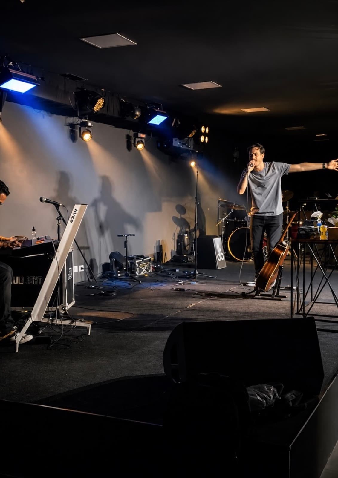 Pedro ministering during the second service, arm raised